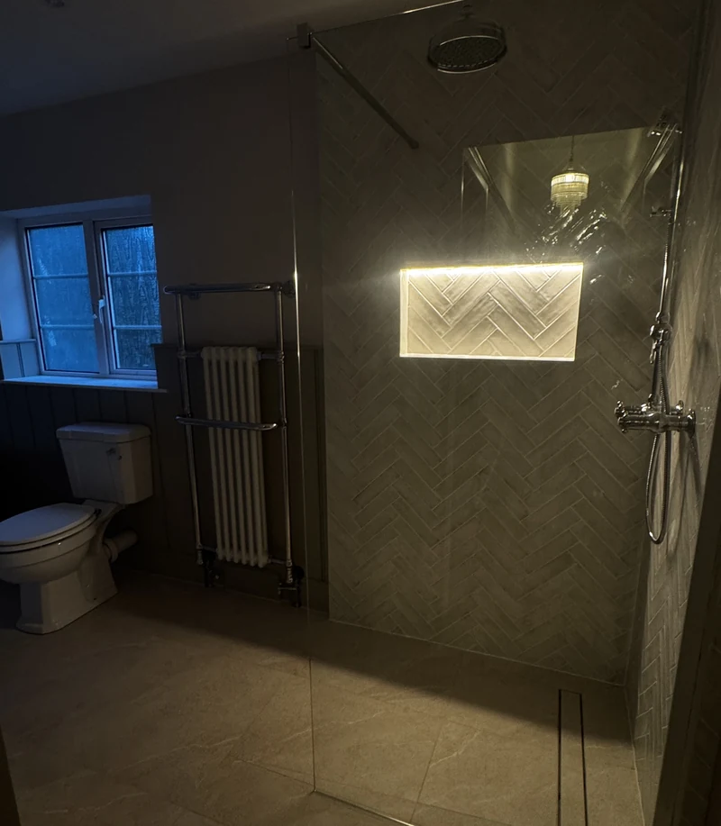 Heated towel rail beside the walk-in shower, bathroom renovation Baldock