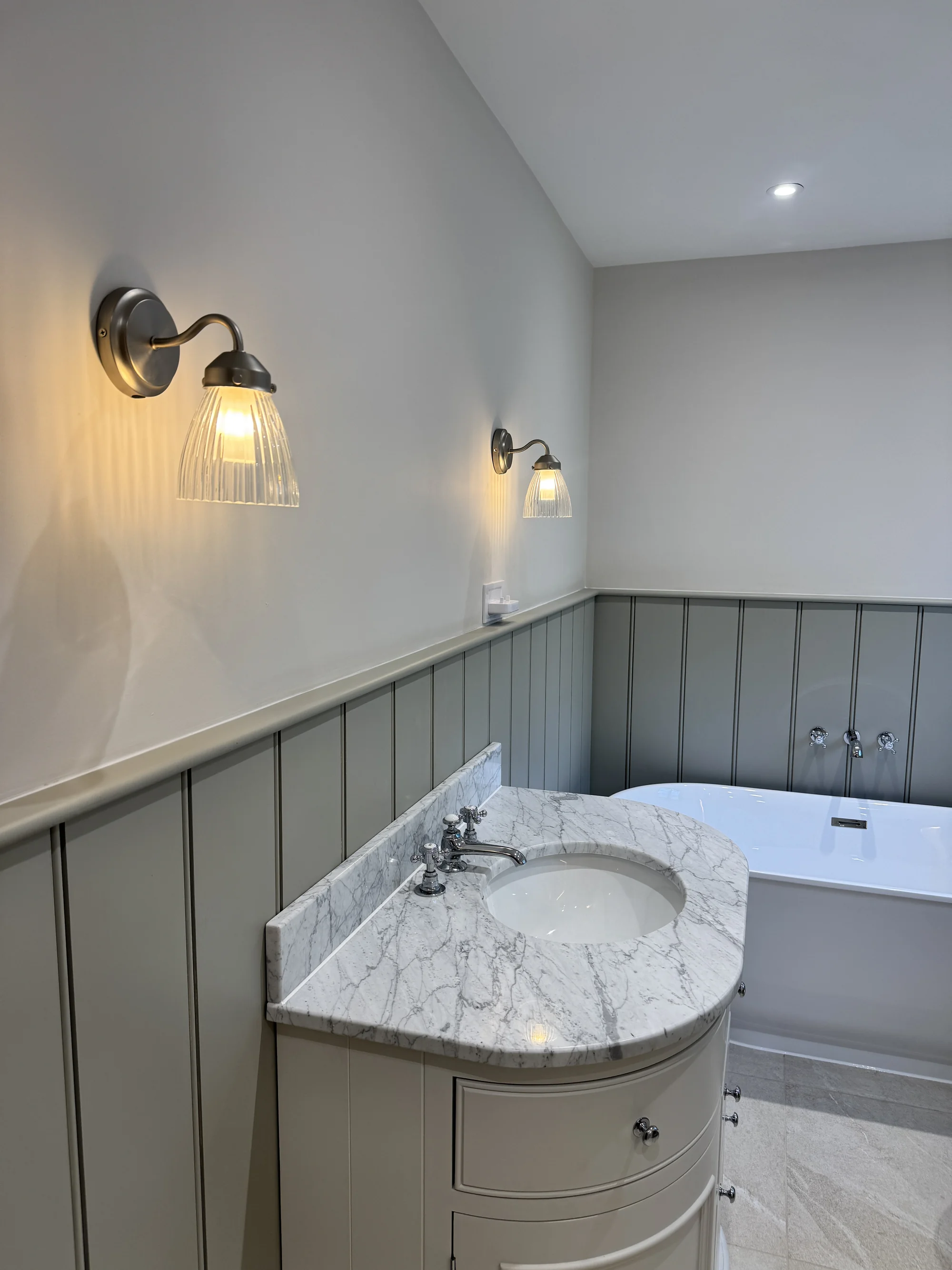 Marble-topped vanity beside the freestanding bath, Baldock