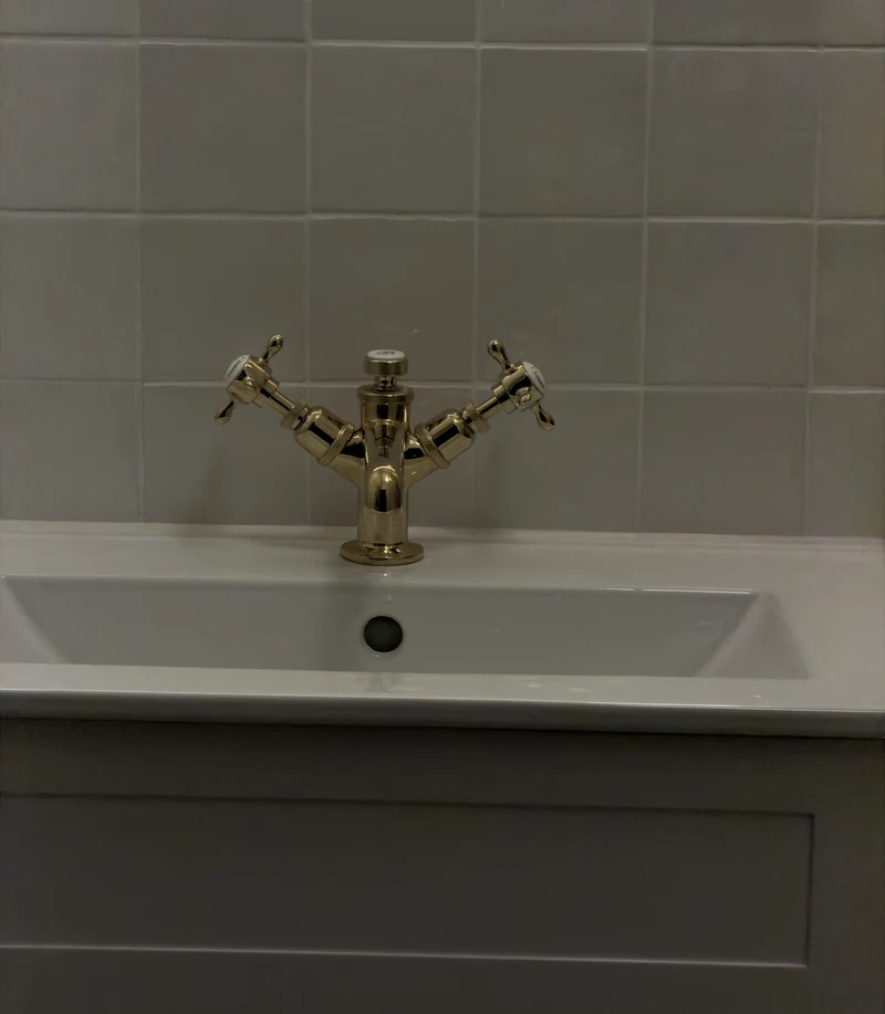 Brass crosshead tap on the countertop basin, bathroom installation Hitchin
