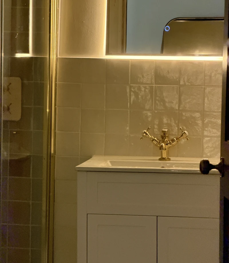 Backlit mirror above the shaker vanity, bathroom installation Hitchin