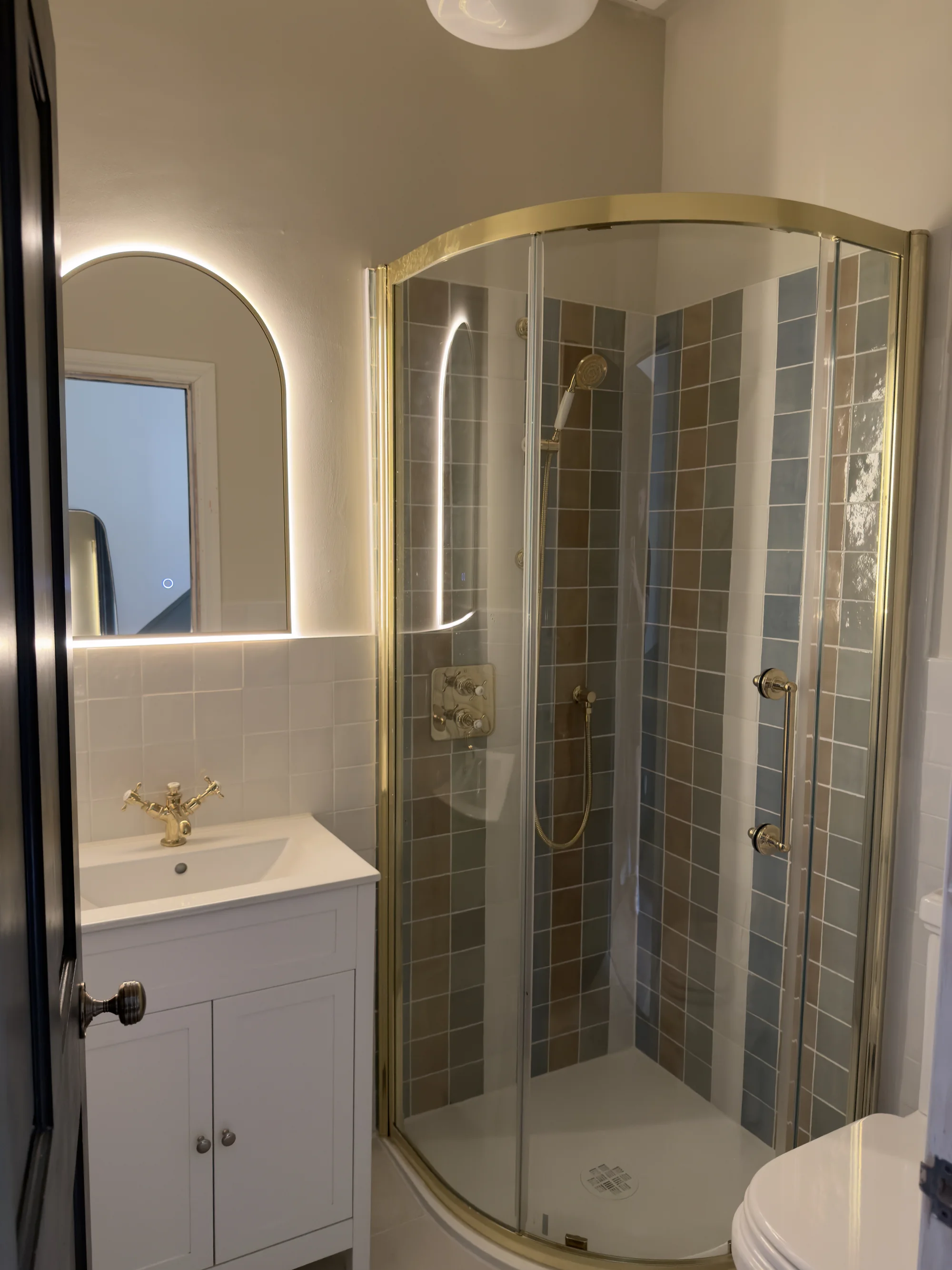 Brass-framed quadrant shower enclosure, bathroom installation Hitchin