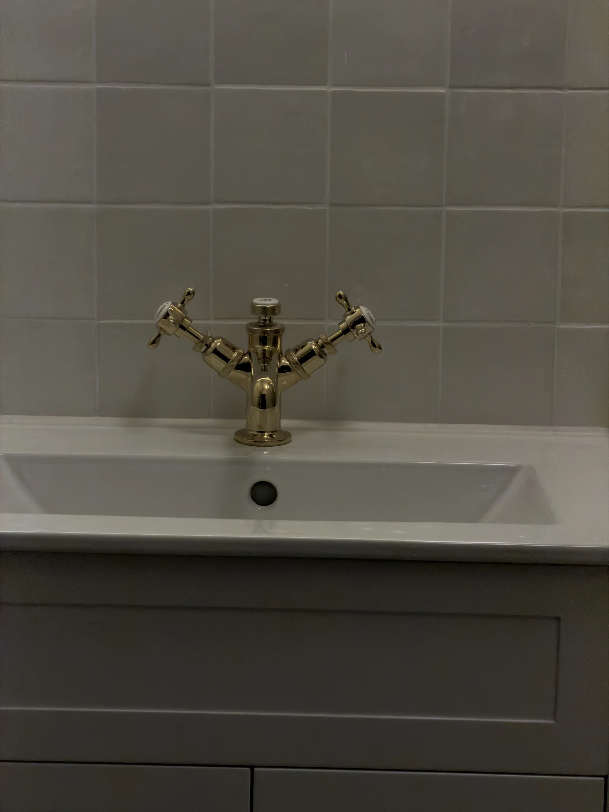 Brass crosshead tap detail on the countertop basin, Hitchin